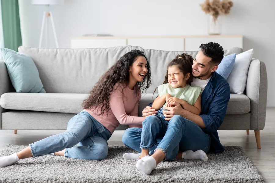 Family laughing together at home